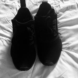 All black New Adidas. Says woman but they are actually unisex.